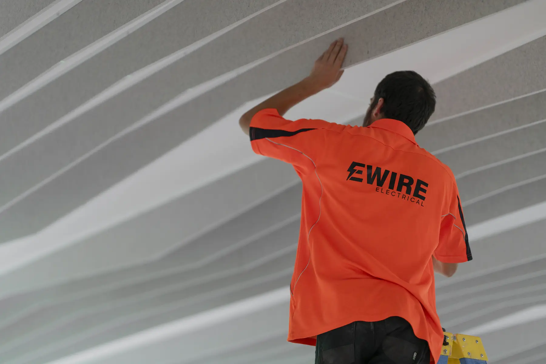 EWIRE electrician performing maintenance work